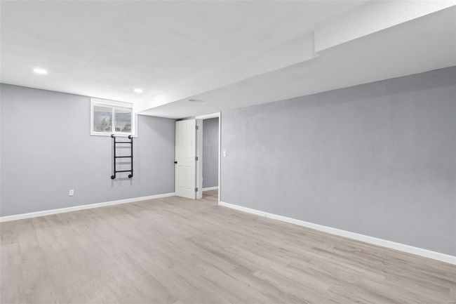 Below grade area featuring wood finished floors, recessed lighting, baseboards, and stairs | Image 23