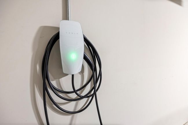 The one car garage is equipped with a Tesla charger | Image 38