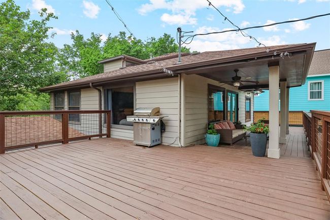Large open patio awaiting your grill master | Image 33