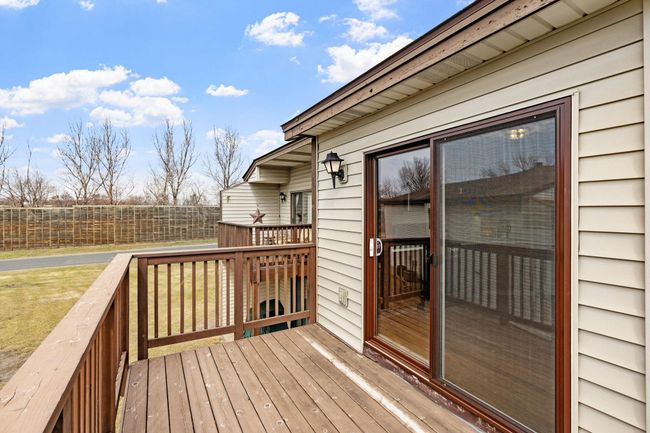 A large slider door leads to your private deck, ready for summer barbecues. | Image 26