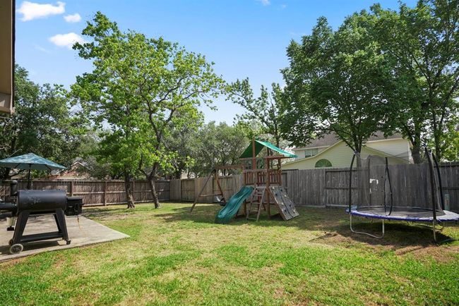 This view of the yard offers another perspective, showcasing the expansive space that provides endless possibilities for outdoor enjoyment and potential future landscaping projects. | Image 35