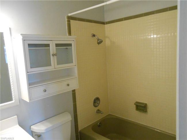 Full bath featuring shower combination and toilet | Image 10