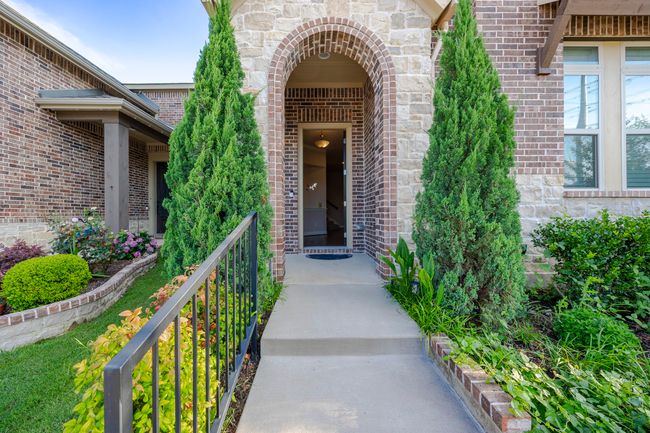 Entrance to property featuring brick siding | Image 5