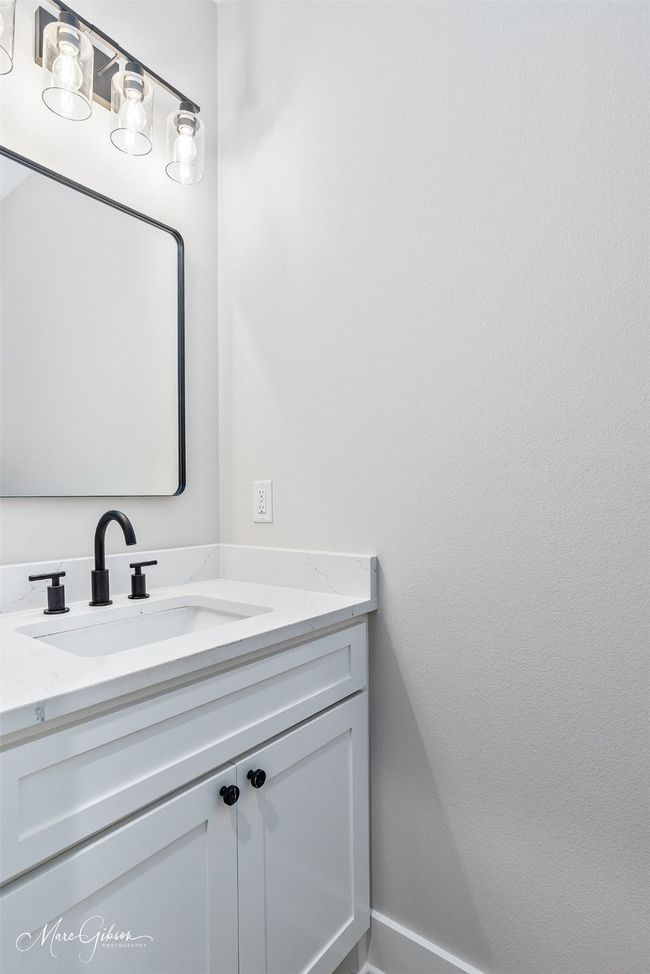 Bathroom featuring baseboards and vanity | Image 20