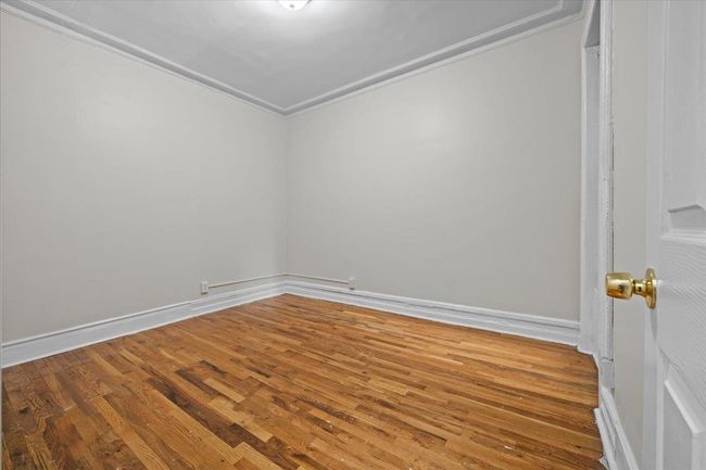 Unfurnished room featuring wood finished floors and ornamental molding | Image 5