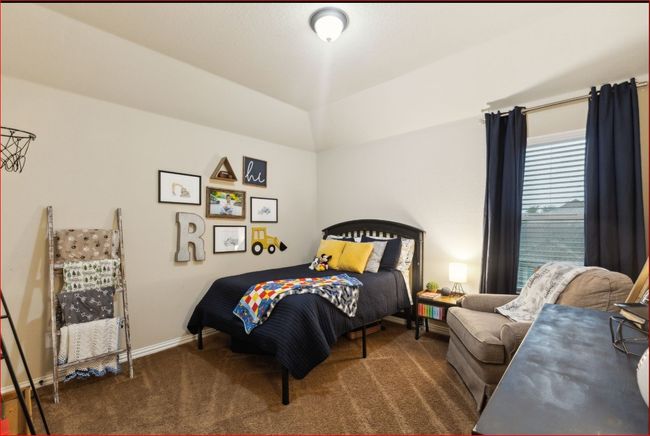 Bedroom with dark colored carpet and baseboards | Image 23