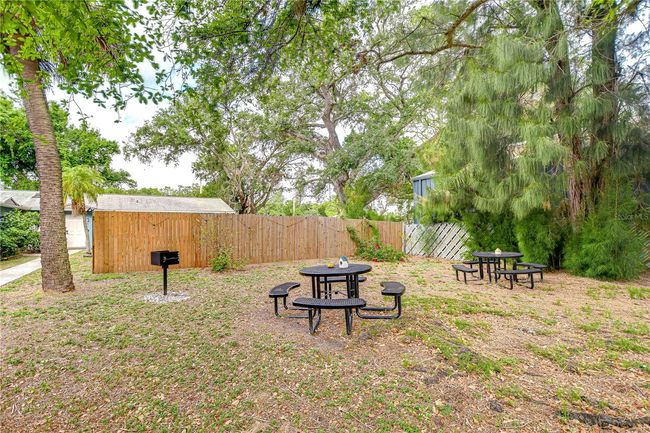 Two charcoal grills are located in the courtyard area | Image 33