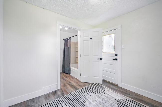 2nd bedroom that grants bathroom access, or bonus space. Easily move laundry to 1st floor for ultimate convenience. With private entry to side yard | Image 16