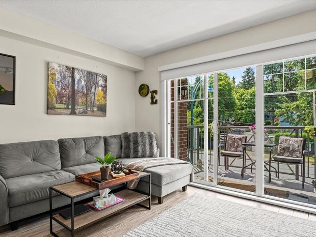 Living area with wood finished floors | Image 5