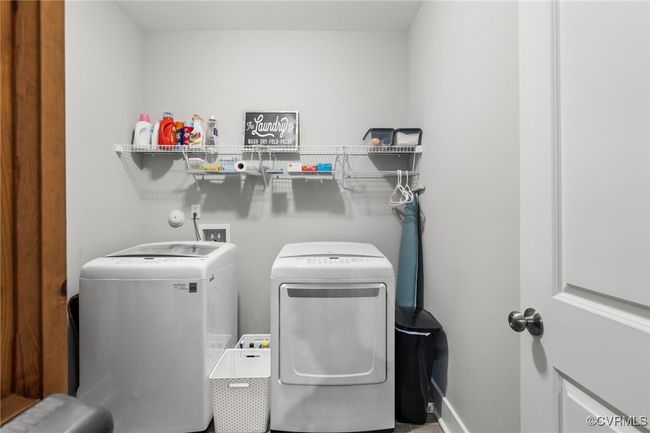 Washroom with separate washer and dryer, laundry area, and baseboards | Image 19