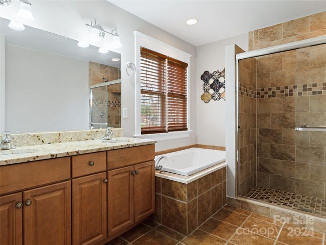 Primary bath with shower and whirlpool tub | Image 15