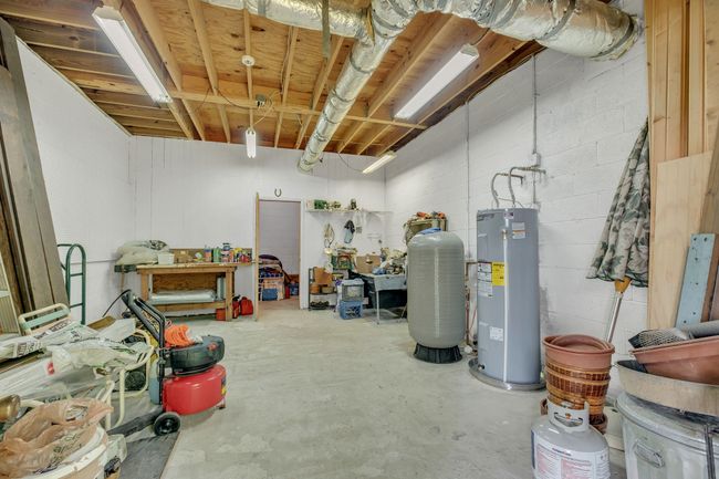 39x27 ft partial basement has entry from the outside and offers great storage, workshop. new water heater 5-2025 | Image 39