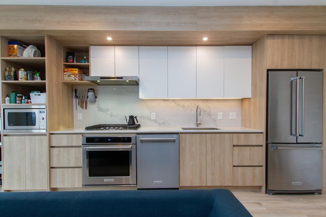 Kitchen featuring a sink, stainless steel appliances, modern cabinets, and light countertops | Image 6