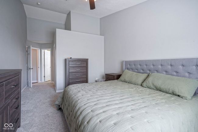 bedroom with a ceiling fan, carpet flooring, and baseboards | Image 19