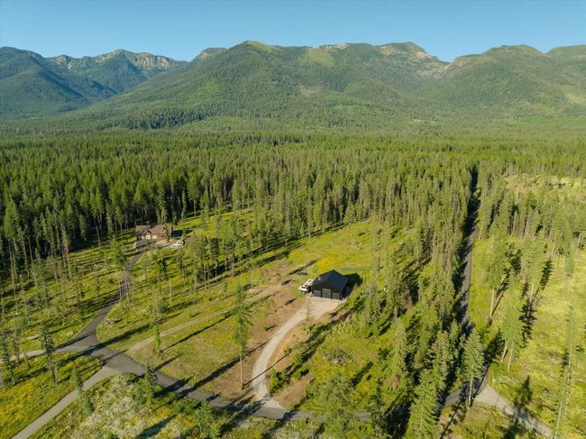 Mountain view featuring a heavily wooded area | Image 69