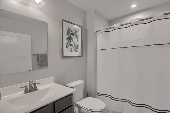 Full bath off entry shared by two bedrooms at front of the house. | Image 12