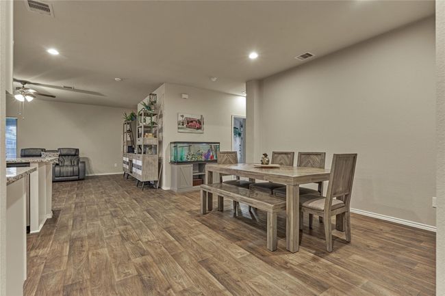 A generous dining room is open to the kitchen and living room and provides ample space for any size furniture. | Image 12