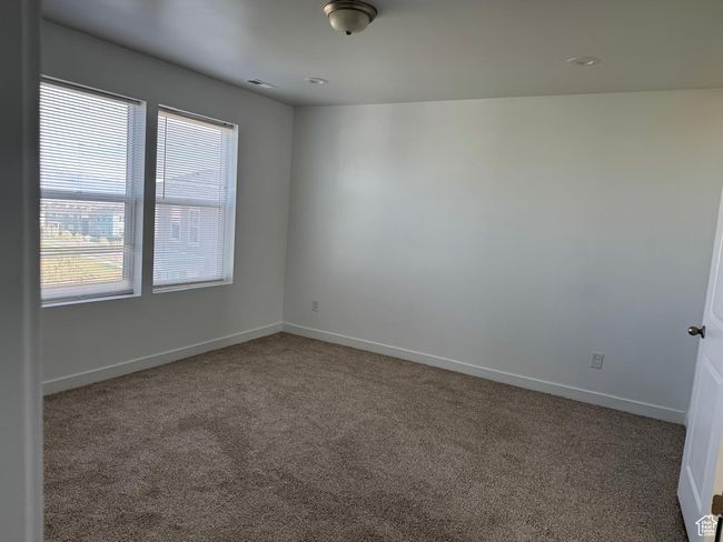 Carpeted empty room with baseboards and visible vents | Image 10
