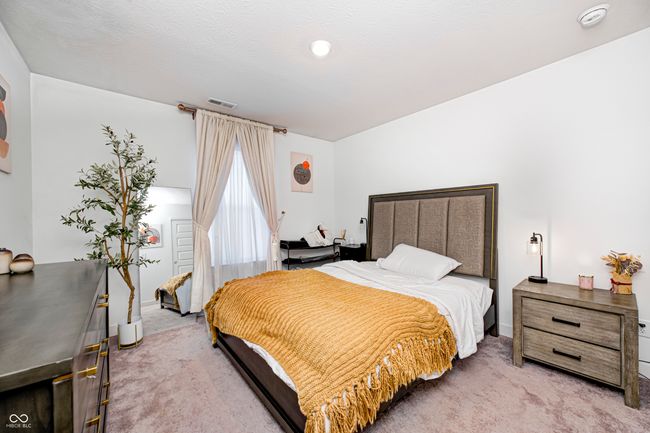 bedroom featuring light colored carpet | Image 17