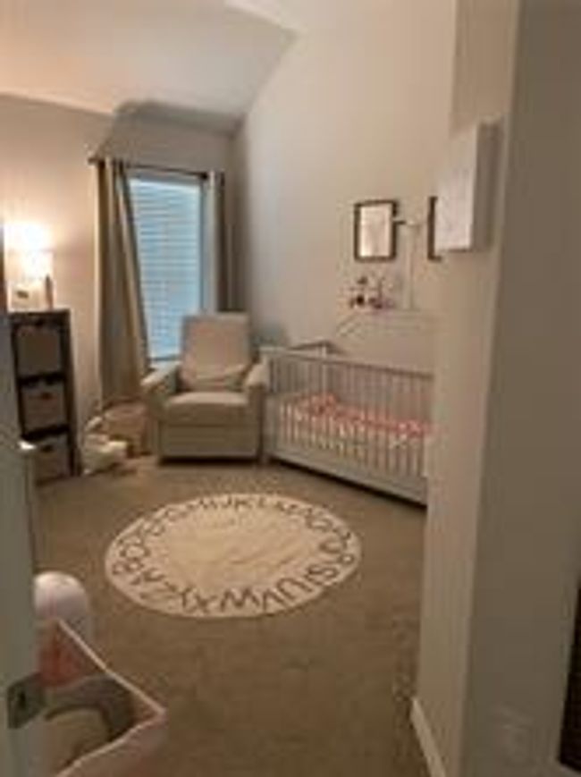 Bedroom with a nursery area and vaulted ceiling | Image 17