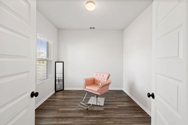 Unfurnished room with baseboards, visible vents, and dark wood-style flooring | Image 6