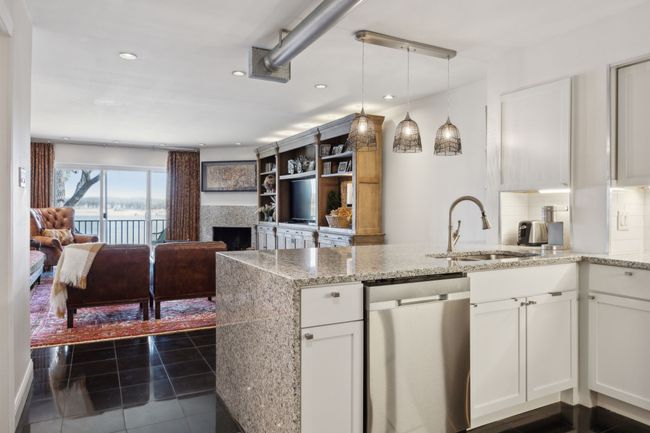 Open kitchen with lake views and ample counter space. | Image 13