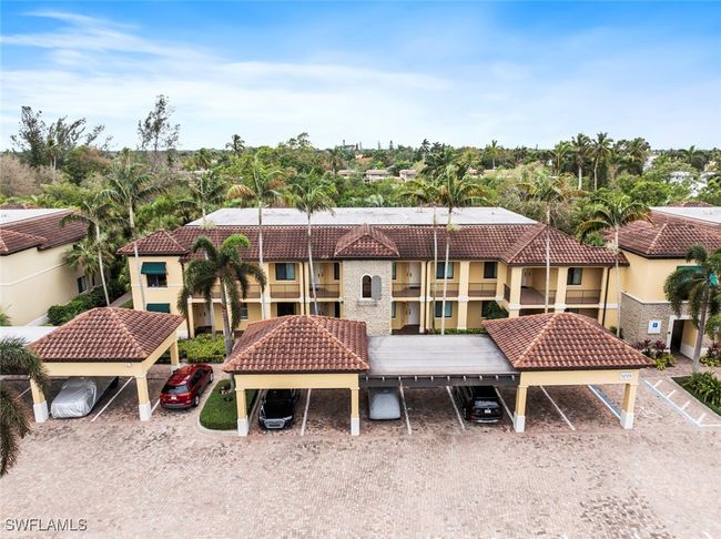 Back of property featuring a balcony and a carport | Image 22