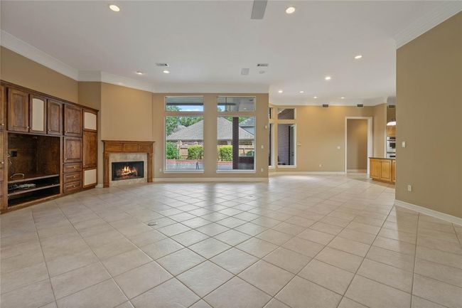Great entry into the large living room connected to the kitchen and overlooking the beautiful backyard! | Image 8