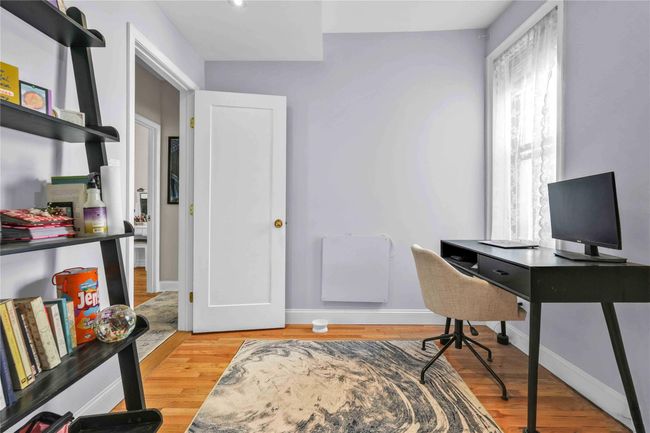 Office area with light wood-style flooring and baseboards | Image 20