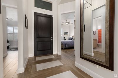 Entrance foyer featuring hardwood / wood-style floors and ceiling fan | Image 3