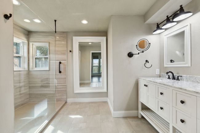 Full bath featuring tiled shower, recessed lighting, vanity, and baseboards | Image 19