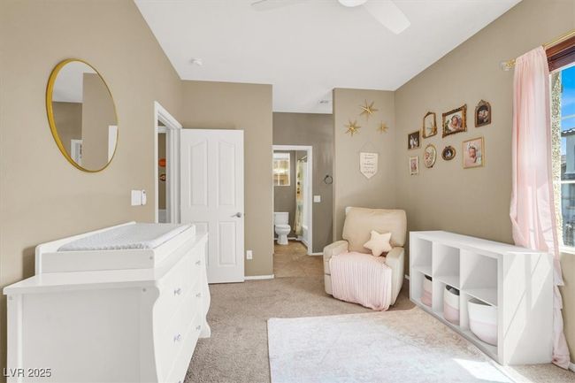 Bedroom with light colored carpet, multiple windows, and baseboards | Image 18