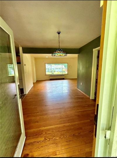 Unfurnished dining area featuring hardwood / wood-style floors | Image 3