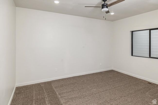 Carpeted empty room with ceiling fan | Image 28