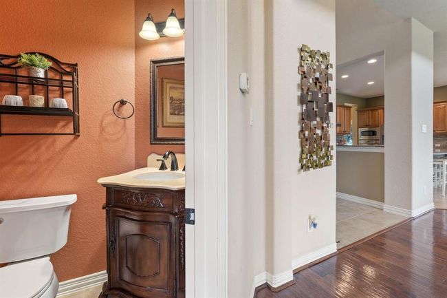 Half bath with a darling pedestal sink. | Image 18