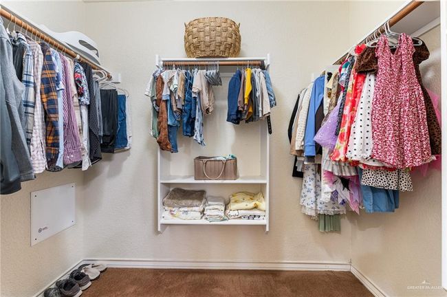 Walk in closet with carpet floors | Image 7