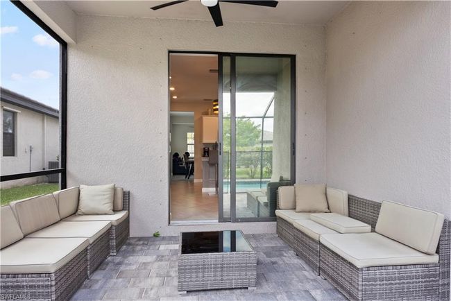 View of patio / terrace featuring outdoor lounge area, central air condition unit, and a ceiling fan | Image 35