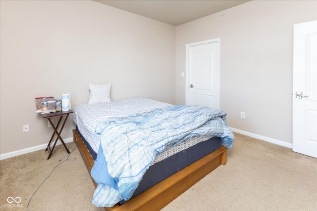 Comfortable carpeted bedroom | Image 13
