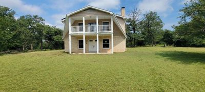 Front of house featuring a balcony and a yard | Image 3