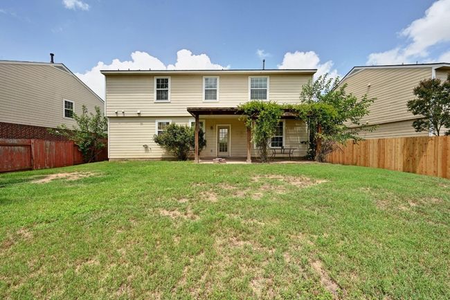 Rear view of house featuring a patio and a fenced backyard | Image 32