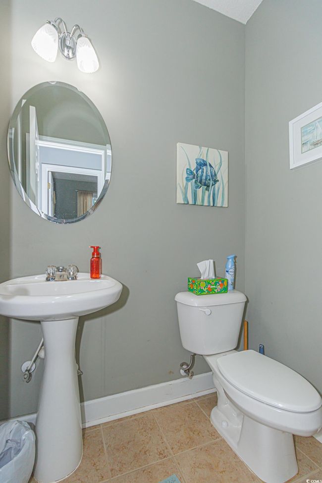 Bathroom with tile patterned floors and toilet | Image 29