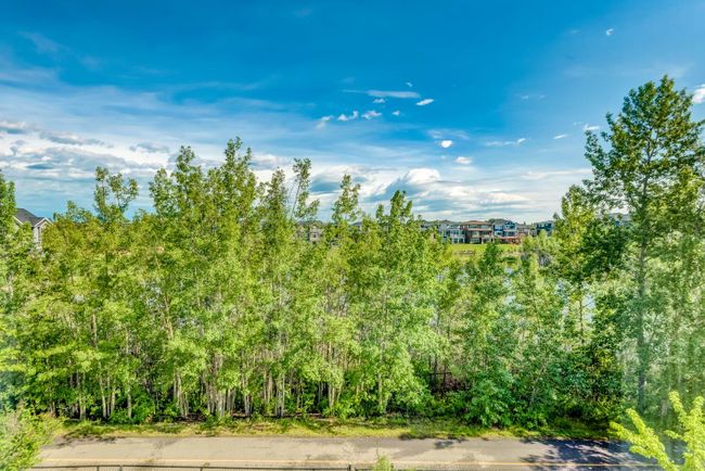 420 Rocky Ridge Cove Nw, Home with 3 bedrooms, 3 bathrooms and 4 parking in Calgary AB | Image 24