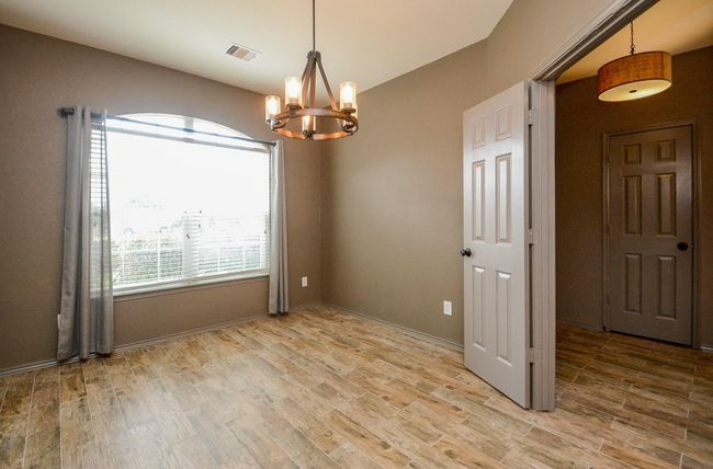 Nicely lit study with views of the front yard. | Image 7