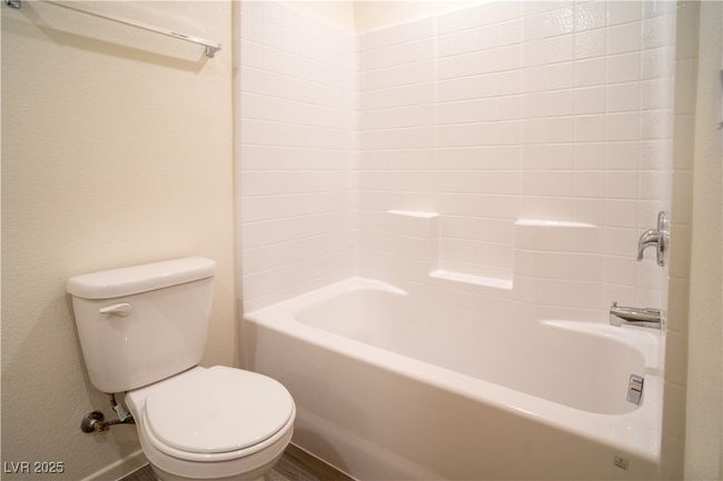 Bathroom featuring toilet and tub / shower combination | Image 15