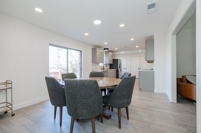 Dining room featuring light wood-type flooring and recessed lighting | Image 7