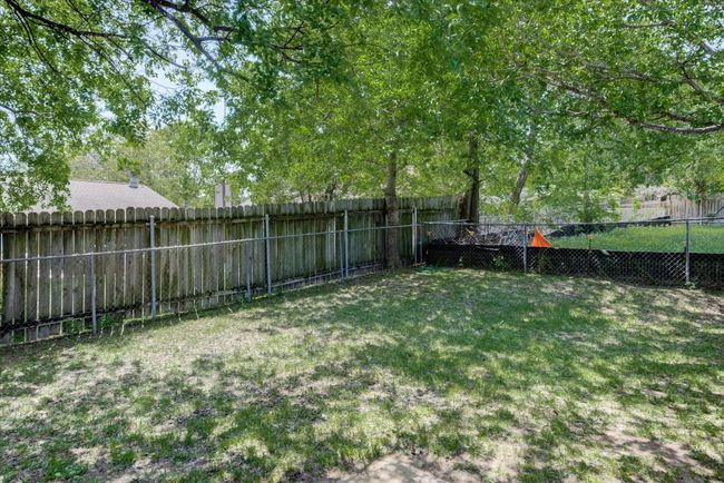 View of yard featuring a fenced backyard | Image 21