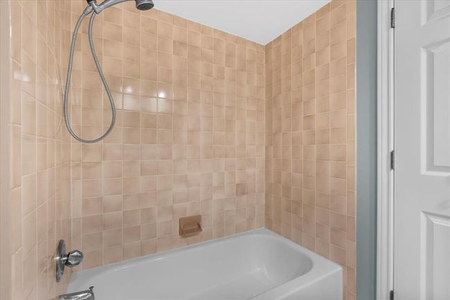Bathroom with tiled shower / bath combo | Image 29