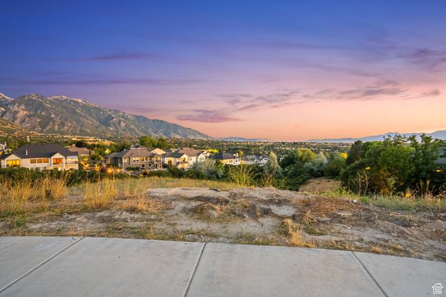 View of mountain backdrop featuring nearby suburban area | Image 27