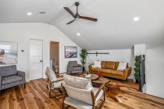 The upstairs loft provides flexible space for living, lounging, or creative use—bringing added versatility to the other building. | Image 32