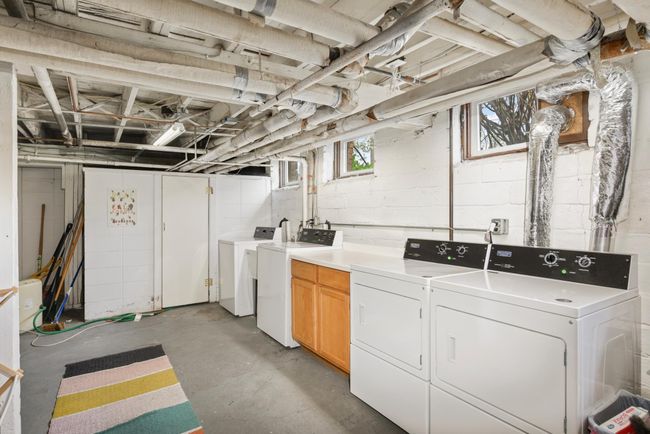 The basement is a massive unfinished community space with shared laundry that is free to use for all 4 condo's. | Image 21